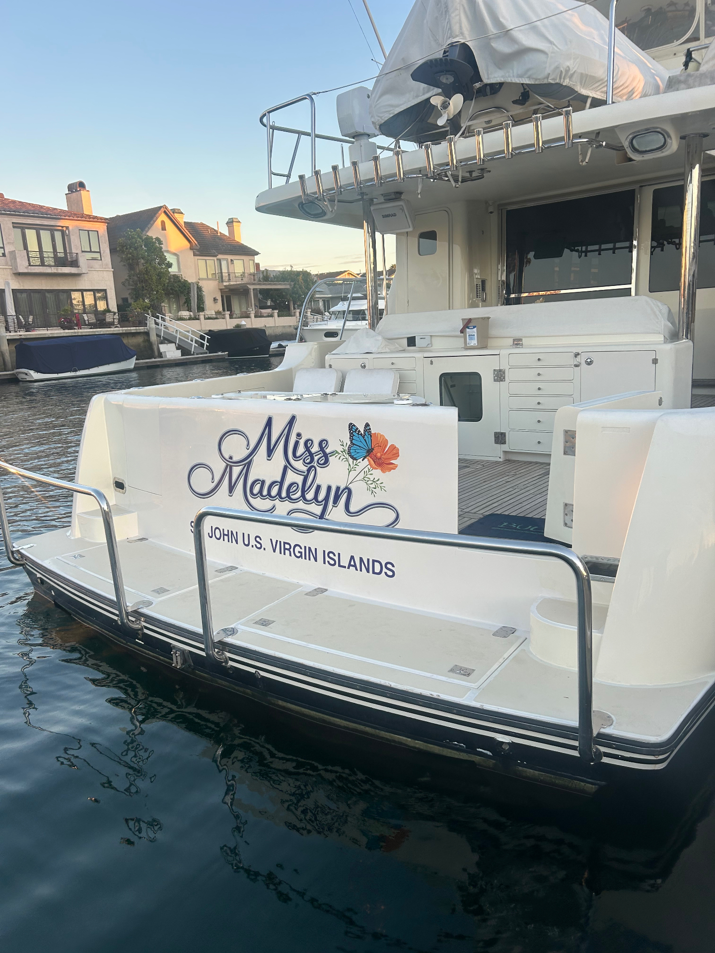 Miss Madelyn custom transom yacht graphic with butterfly and floral artwork