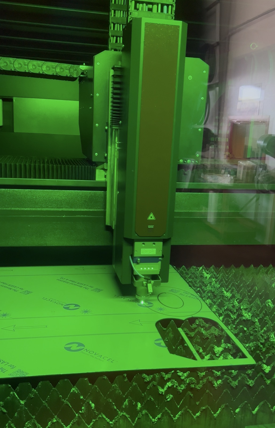 Fiber laser cutting a stainless steel yacht sign component in-house