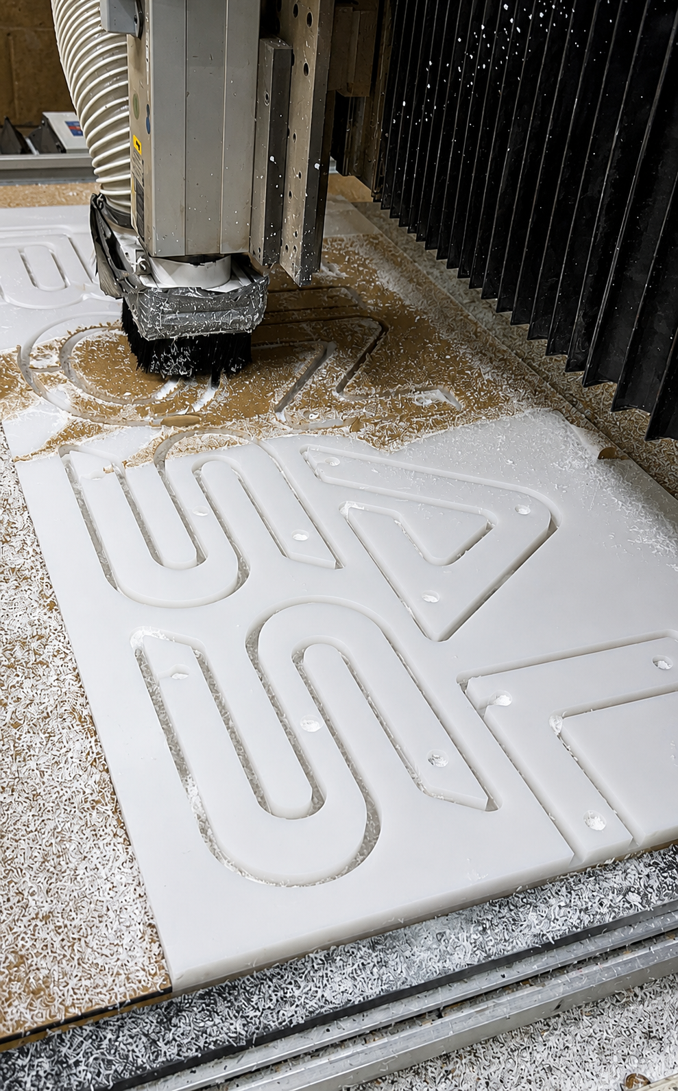 CNC router cutting dimensional yacht sign letters from a solid stock blank