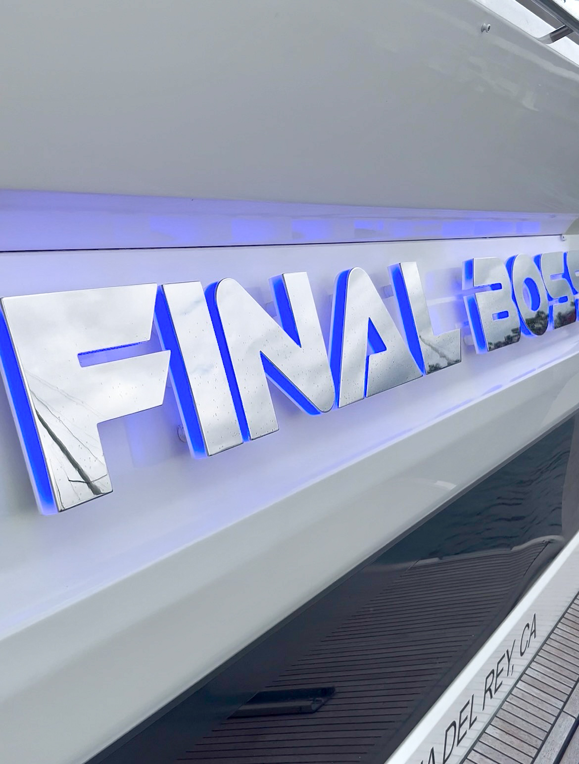 FINAL BOSS halo-lit stainless steel yacht name with blue LED glow